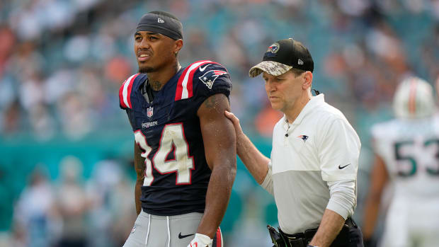 Patriots wide receiver Kendrick Bourne (84) leaves the field after being injured during the second half against the Dolphins.